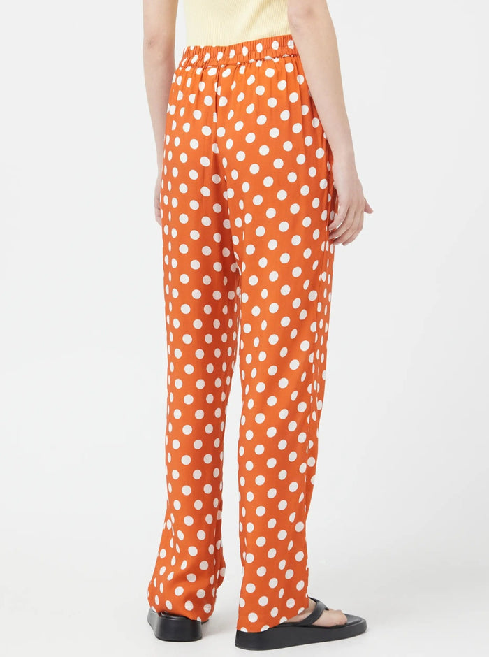 Pantalon orange à pois blanc Compania Fantastica vendu à Montréal.