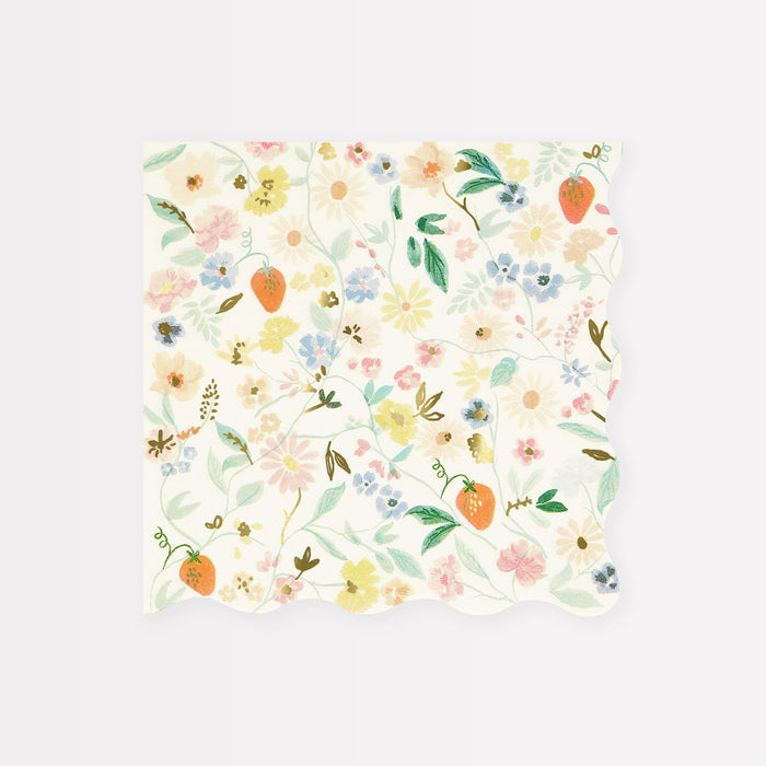 A white scalloped dinner napkin with a floral pattern featuring pastel colors and strawberries against a white background.
