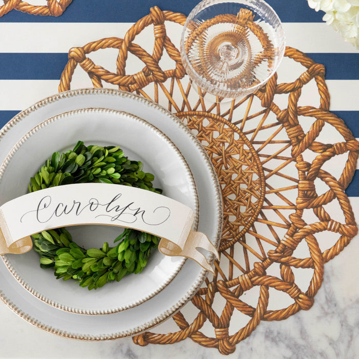 The Die-cut Rattan Weave Placemat under an elegant place setting, from above.