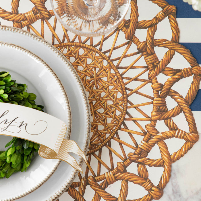 Close-up of the Die-cut Rattan Weave Placemat under an elegant place setting, from above.