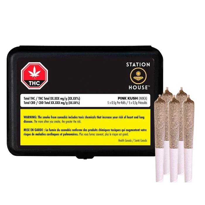 Front-facing shot of a black Station House Pink Kush PR 5 x 0.5 g tin with a yellow warning label and three pre-rolls standing beside it.