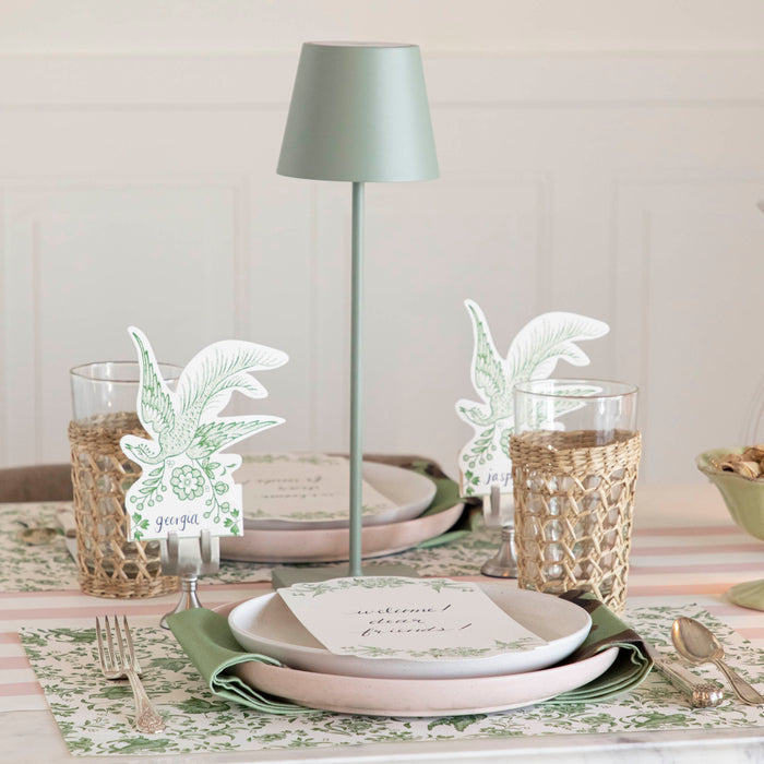 A table setting with place settings and a Zafferano Sage Cordless Lamp.
