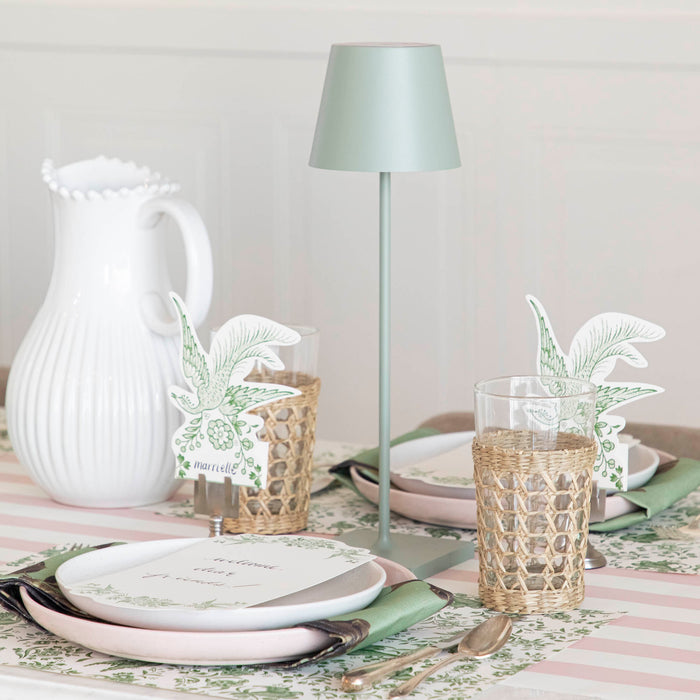A table setting with place settings and a Zafferano Sage Cordless Lamp.